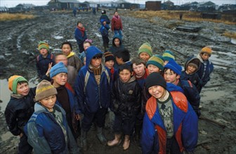 Children of reindeer breeders of the taymyr peninsula in siberia waiting to be airlifted by helicopter to a boarding school in nosok for the winter, 1998.