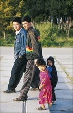 A turkmen family going for a walk in ashgabat (ashkabad), turkmenistan.