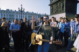 A street musician performing at the triumph column in palace square, st, petersburg, russia, 2000.