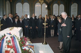 Russian president boris yeltsin and wife naina before the tomb with the remains of tsar nicholas ll at the burial ceremony in the cathedral of sts, peter and paul, july 1998.