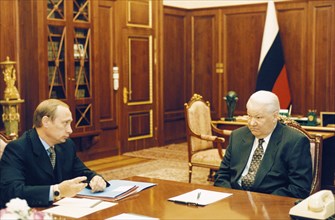 Russian president boris yeltsin meeting with the director of the federal security service, vladimir putin, february 1999.