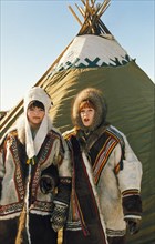 Young nenets women in traditional costume, april 1999.