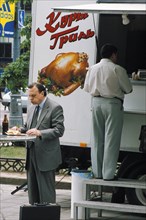 Truck selling grilled chicken - popular among those who can afford it - in moscow, june 1999.