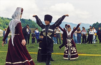 Young members of the almat folk dance ensemble performing during a demonstration of balkar highland culture, kabardino-balkaria, russia.