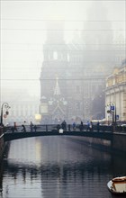 Italian bridge over st, catherine's canal in st, petersburg, russia on a foggy day, 1999, the church of our savior on the spilled blood is beyond.