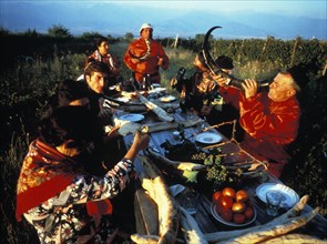 A georgian family eating shoti bread etc, outdoors, georgian ssr, 1985.