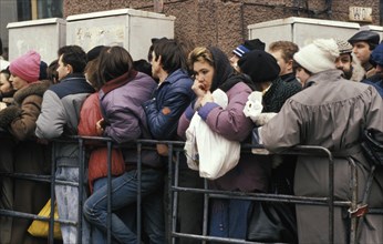 People standing in a long line to buy basic foods which are scarce and expensive, moscow, russia, 1991.