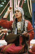 Aijamal turayeva from the mary region of turkmenistan playing a dutar.