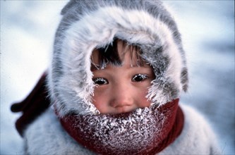 Dudinka, krasnoyarsk territory, siberia, russia, little girl of indigenous tribe in a fur hat.
