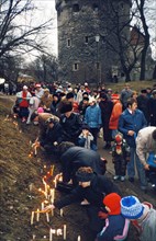 Tallinn residents lighting candles and celebrating the first anniversary of estonia breaking away from the ussr (day of independence), february 24, 1990.