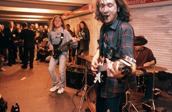 A rock band performing in an underground pedestrian passageway in moscow, june 2000.