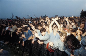 A crowd of fans at an outdoor rock festival in moscow, russia, early 1990s.
