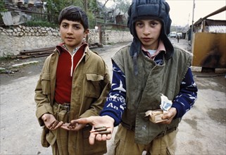 Children bring up ammunition to soldiers during the nagorno kharabakh conflict, may 1992.
