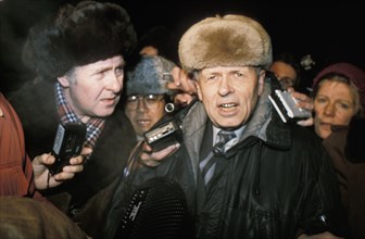 Soviet academician, andrei sakharov, being interviewed by the press upon his arrival in moscow at the yaroslavl railway terminal on december 23, 1986.