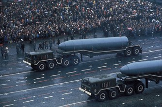 Soviet trucks carrying ss-n-6 submarine missiles during a military parade in red square, moscow, november 1974.