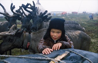 Edik rochov, a boy who is the son of siberian reindeer breeders in the nenets autonomous region of russia, 1990s.