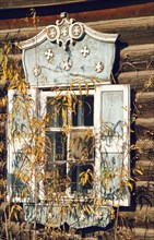 A window on a wooden house on kirov street in yakutsk, yakutia, siberia, russia.