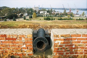 The ruins of azov fortress with the port and the don river in the background, azov, russia.