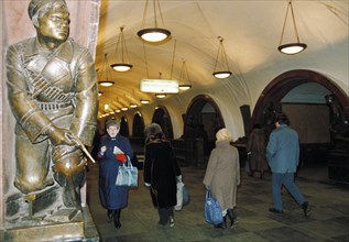 Bronze statue of a bolshevik seaman in the revolution square metro station in moscow, 1990s.