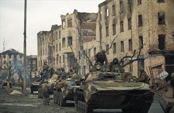 Russian interior ministry troops on the streets of grozny, chechnya, destruction is do to russian shelling of the city, february 1995.