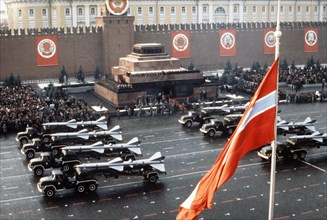 Trucks bearing sa-1 and sa-2 surface -to-air missiles during a military parade in red square celebrating the 65th anniversary of the great october socialist revolution, november 7, 1982, moscow, ussr.
