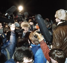 Soviet academician, andrei sakharov, being interviewed by the press upon his arrival in moscow at the yaroslavl railway terminal on december 23, 1986.