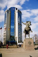 Monument to bagration, hero of the war of 1812, on kutuzov avenue with a newly built (2000) office building in the background, moscow, russia, april 2004.