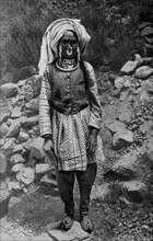 Historical Geography. 1900. India. Pahari woman engaged in a toilsome task
