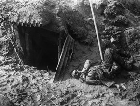 A dead German outside his dug-out.