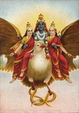 God Vishnu rides on his vehicle Garuda with two wives
