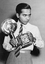 Satayan as staff photographer of Deccan Herald using a Speed Graphic press camera