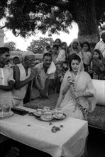 Maharani Gayatri Devi of Jaipur with villager during her campaign for election to the Indian Parliament