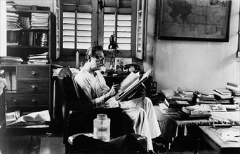 Satyajit Ray at work in the drawing room of his apartment in Calcutta India