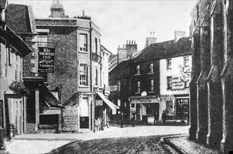 Faringdon village street scene depicting the Volunteer Inn and various shops