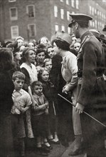 Queen Elizabeth visiting the people of London during World War Two