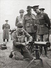 King George VI watching a blindfolded Australian soldier assemble a machine gun