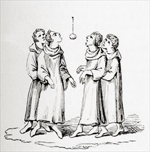 Monks in the middle ages playing Bob-Apple