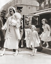 The Duchess of York arriving at the Royal Tournament at Olympia in 1935 with her daughters Princess Margaret
