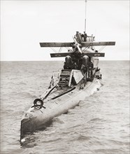 The HMS M2 Royal Navy submarine monitor carrying her Parnall Peto seaplane. Seen here in 1932 shortly before sinking.  From These Tremendous Years
