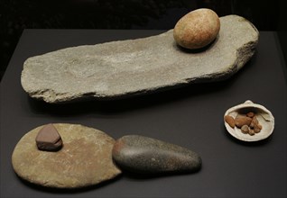 From left to right and from back to front: Grindstone, El Garcel (Antas, Almeria province, Andalusia) and El Higueron Cave (Rincon de la Victoria, Malaga province, Andalusia); Grindstone, pestle and d...