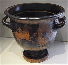 Bell krater depicting a winged Nike offering a libation to a young nude rider