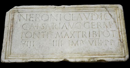 Stone plaque dedicated to emperor Nero (Nero Claudius Caesar Augustus Germanicus)  (37-68 AD) honouring his person and lists his titles: Pontifex Maximus, Tribune, Consul, Emperor and Father of the Ho...