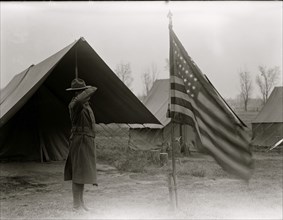 African American Soldier salutes the flag