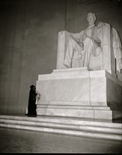 Marion Anderson before a statute of President Lincoln in the Memorial in DC