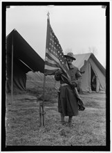 African American soldier embraces the Stars & Stripes