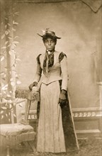 Young African American woman, full-length portrait, standing