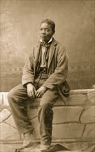 Portrait of an African American man, seated