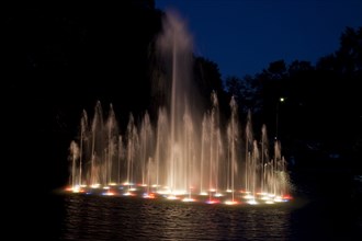 Water dances on the surface during the water show at Spring Park, Tuscumbia, Alabama