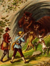 Dogs bark at the mouth of a cave ay two large brown bears