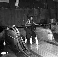 African American in boy at a bowling alley